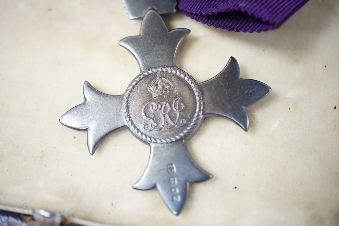 A civilian OBE with ladies bow ribbon, hallmarked for London 1929 in a Garrard’s fitted case, together with a small collection of Royal memorabilia relating to the coronation and death of George VI. Condition - fair, hin